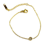 Изчистена златиста гривна с блестящ камък